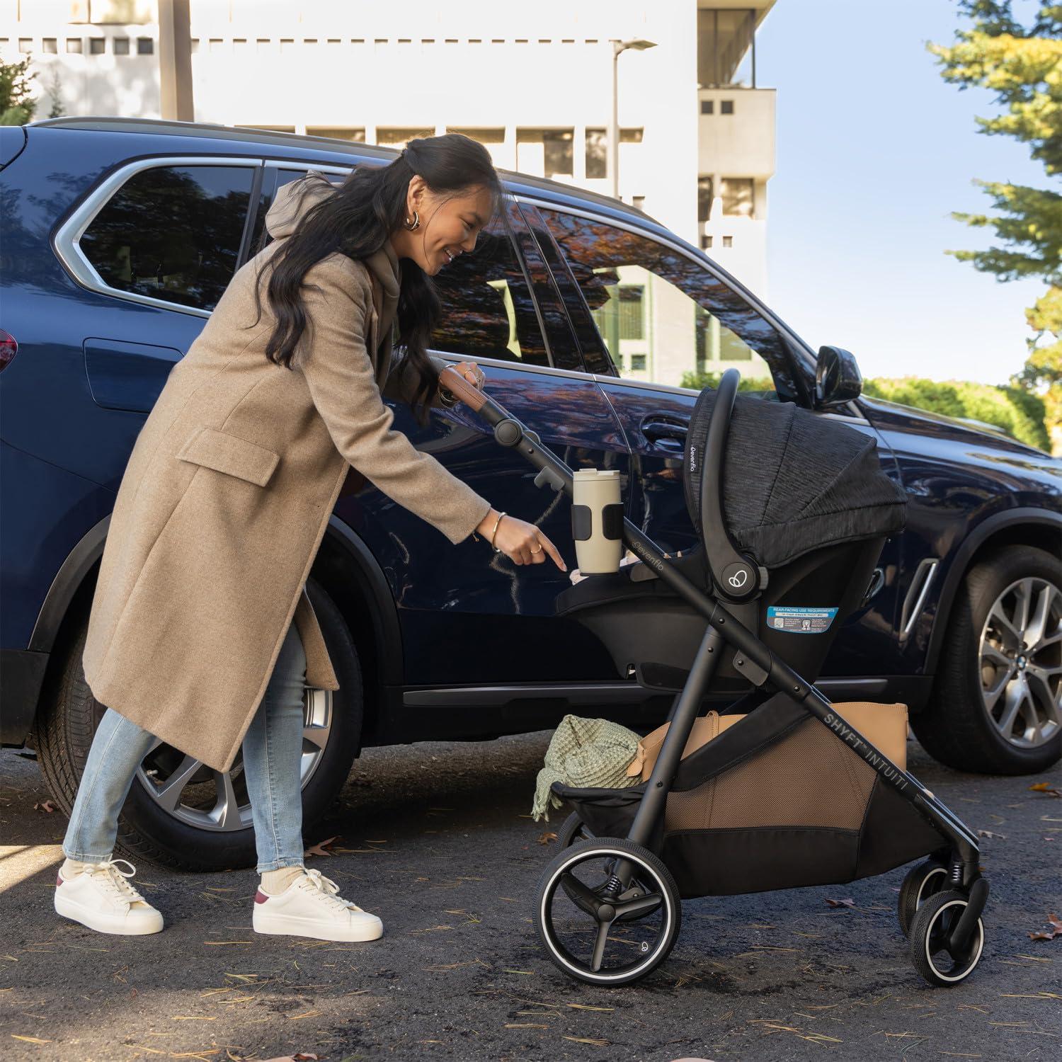 imageEvenflo Shyft Intuiti Travel System Featuring Revolve180 LiteMax NXT Rotating RearFacing Lightweight Preemie and Infant Car Seat with SensorySoothe 330 lbs Dubhan BlackBlack Shale